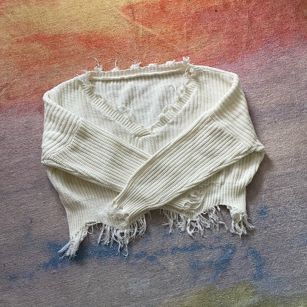 white distressed sweater
